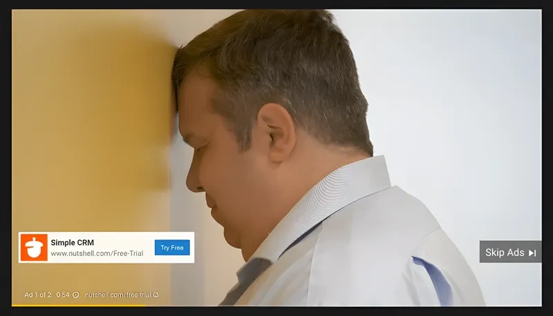 Person looking frustrated while watching ads on YouTube